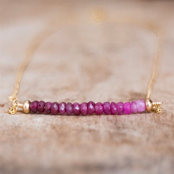 Fashion Jewelry Jewelry - Gold with pink bar of stones. New in package.